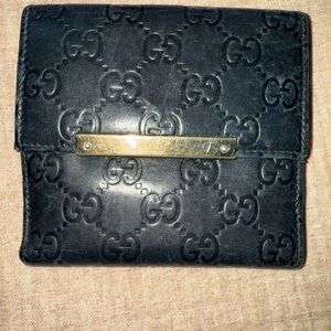Gucci Embossed Black Wallet with Gold Detail